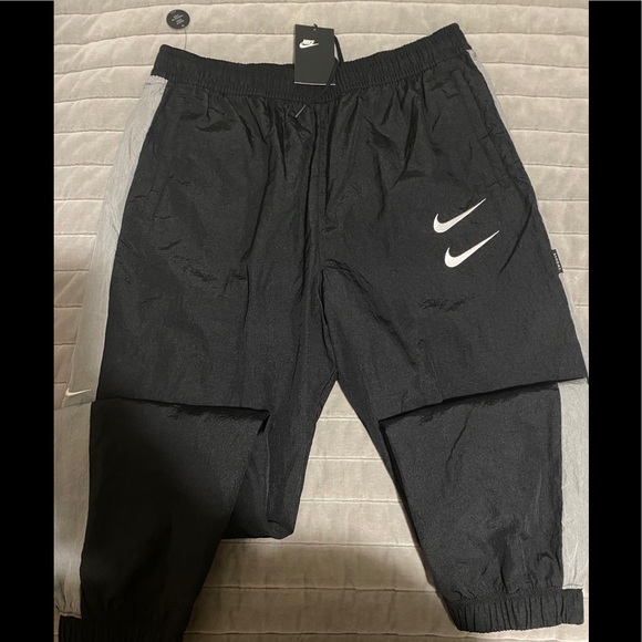 nike taped swoosh woven pant